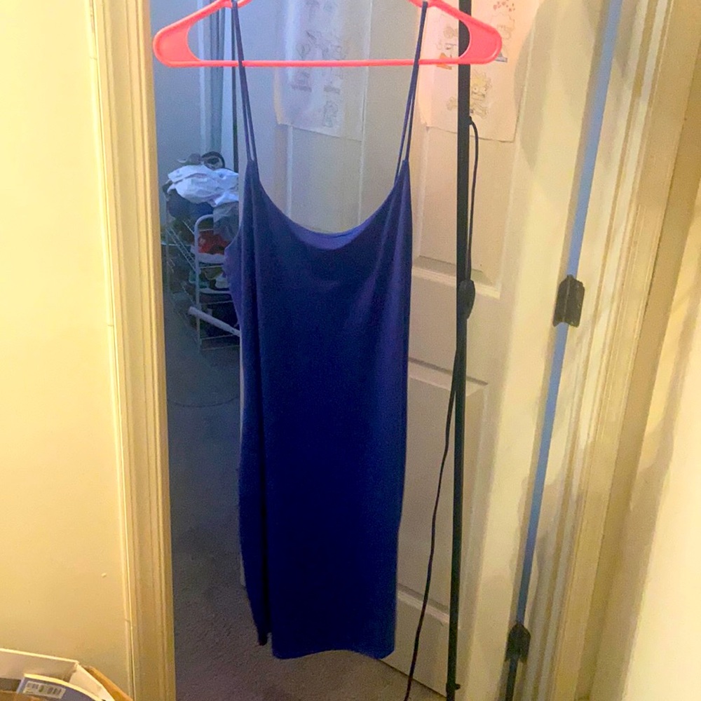 This is a short blue dress that is from Mexico